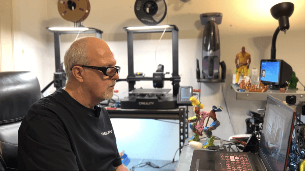 Running his multi-printer setup for daily production