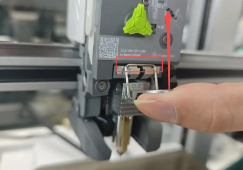 Flip the hotend release lever upward