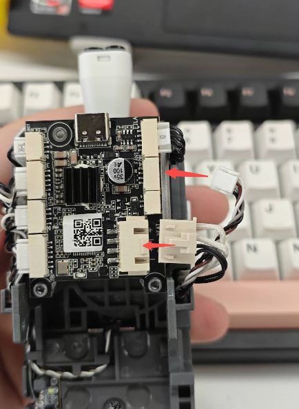 Arrange the cables of the fan and Heating Assembly neatly in the cable channels (2)
