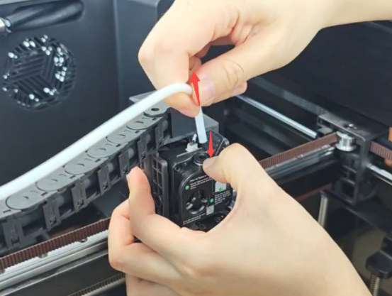 Press the tube connector and pull out the PTFE tube