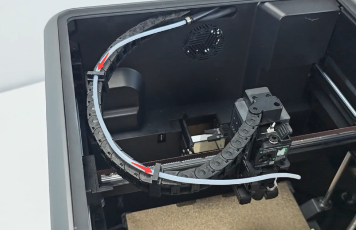Thread the PTFE tube through the fixing clip