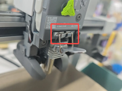 Engage the latch hook into the upper slot