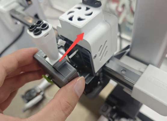 Reinstall the new extruder front housing